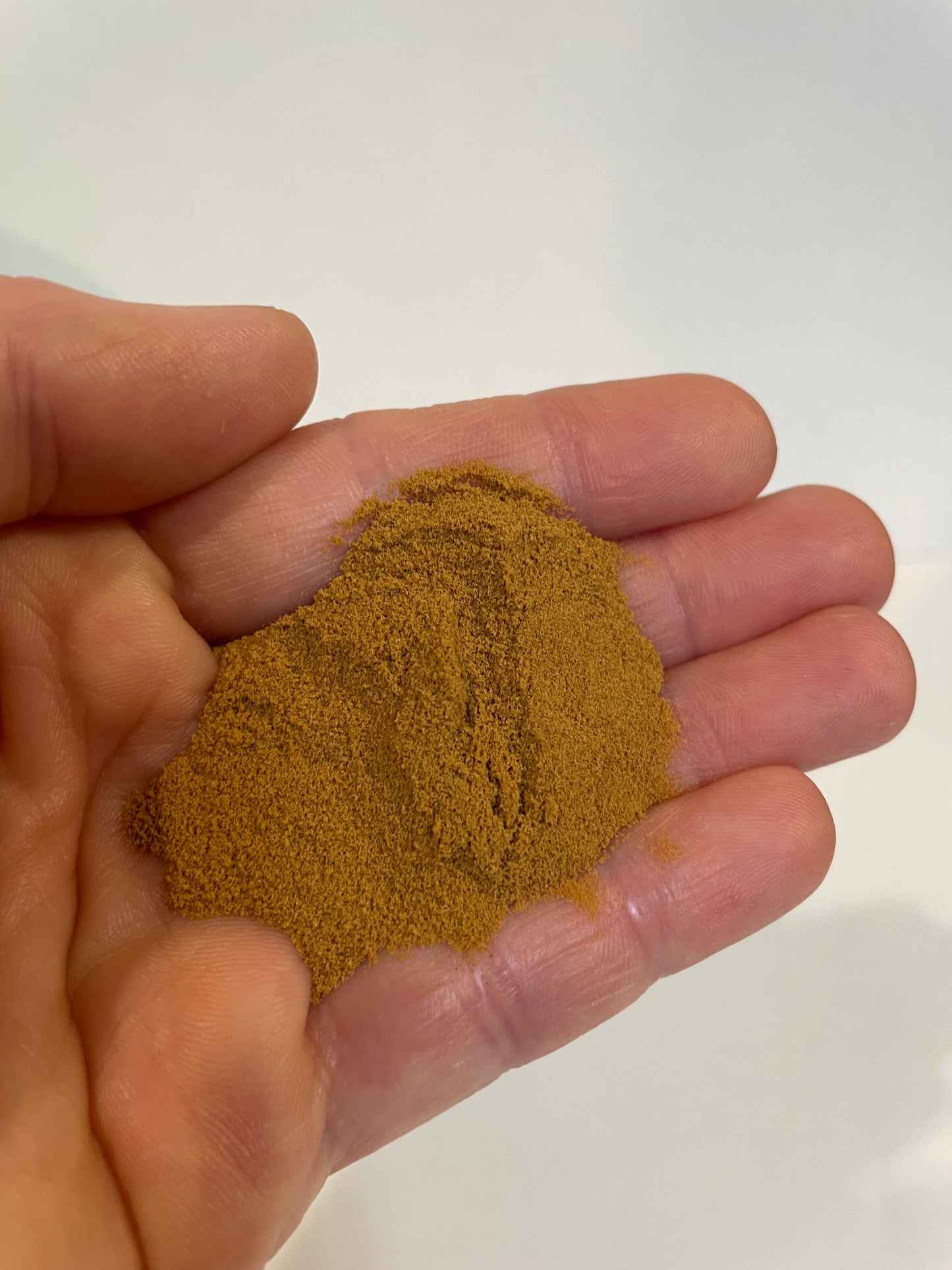 Magic Fish feed has the consistency of cinnamon.